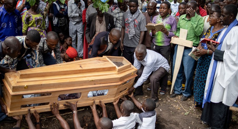 Mourners gather for a funeral for two victims of the attack on Ugandan school that occurred on June 16, 2023.Stuart Tibaweswa/AFP via Getty Images