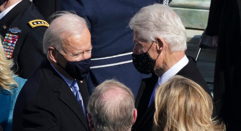 Former President Bill Clinton, right, and President Joe Biden, left, speak after the 59th Presidential Inauguration ceremony at the U.S. Capitol in Washington, Wednesday, Jan. 20, 2021.