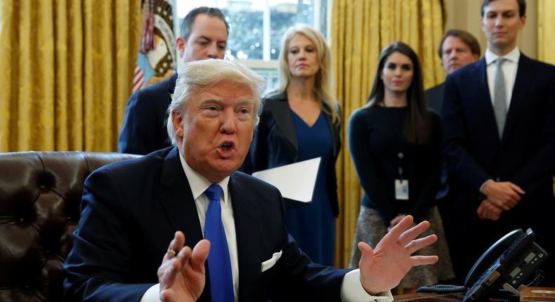 U.S. President Donald Trump speaks to reporters while signing executive orders at the White House in Washington January 24, 2017.