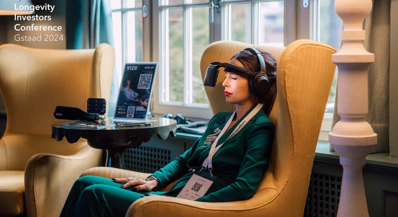 Moderator Martina Fuchs trying out some of the new tech on display at the Longevity Investors Conference in Gstaad, Switzerland.Longevity Investors Conference / David Biedert