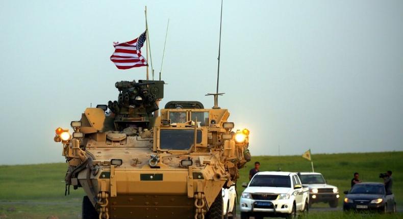 US forces accompanied by Kurdish People's Protection Units fighters patrol the Syria-Turkey border late last month