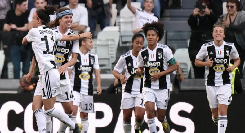 Danish midfielder Sofie Junge Pedersen (2ndL) celebrates after scoring the winning goal for Juventus's women's team against Fiorentina.