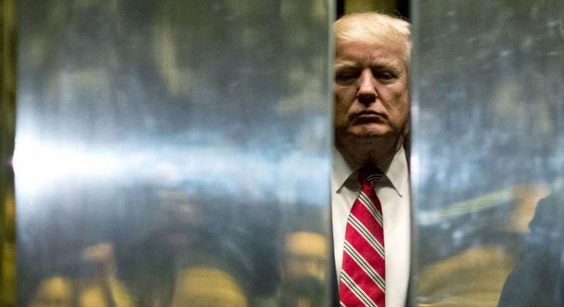 Then President-elect Donald Trump boards the elevator at Trump Tower in New York City on January 16, 2017.