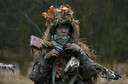 Trynkiewicz carries his weapon during territorial defence training organised by SJS Strzelec (Shooters Association), paramilitary group in the forest near Minsk Mazowiecki