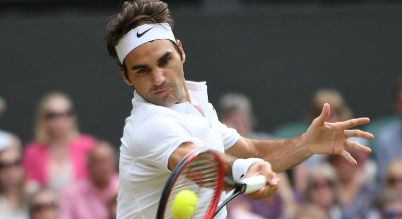 Switzerland's Roger Federer plays against Canada's Milos Raonic during the Wimbledon Championships men's semi-final match in southwest London, on July 8, 2016