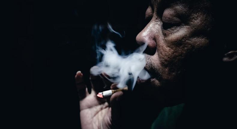 An old man smoking cigarette