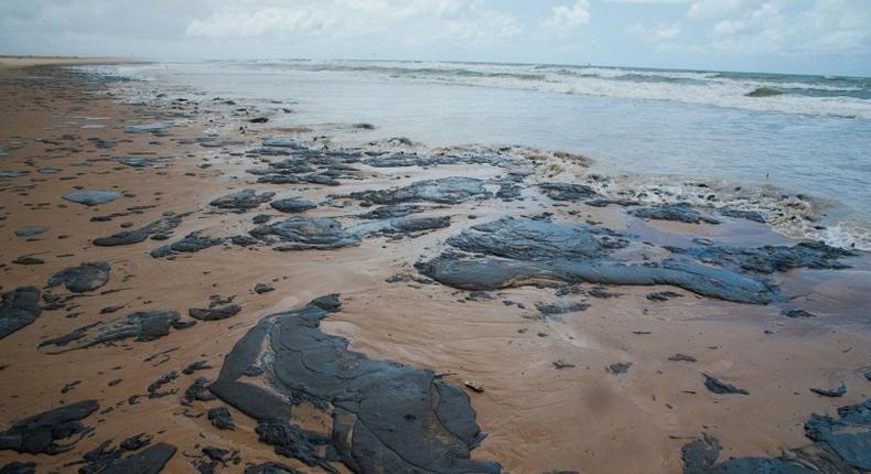 A handout picture released by the Sergipe State Environment Administration on September 25, 2019, shows oil spilled on a beach in Pirambu, Sergipe state, Brazil