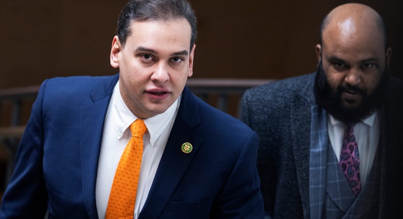 Rep. George Santos, R-N.Y., left, and aide Vish Burra are seen in the Capitol Visitor Center after a meeting of the House Republican Conference on Tuesday, February 7, 2023.Tom Williams/CQ-Roll Call, Inc via Getty Images