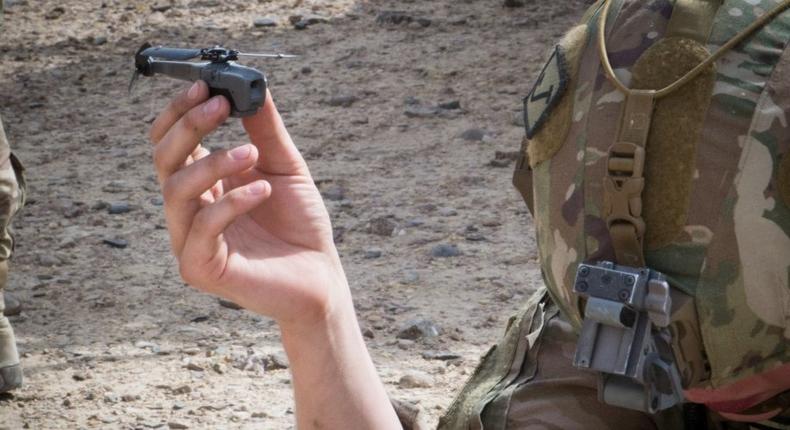 A paratrooper from the 3rd Brigade Combat Team, 82nd Airborne Division prepares to launch a Black Hornet personal Unmanned Aerial System Friday, August 9 in Kandahar, Afghanistan in support of a dismounted patrol in the region.