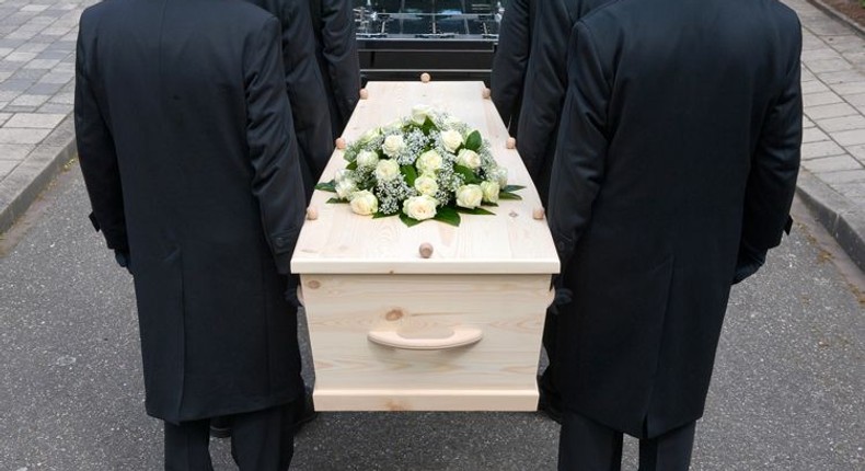 Pallbearers carrying a casket