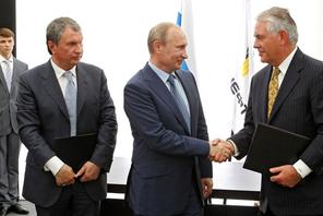 Russia's President Putin, Rosneft CEO Sechin and Exxon Mobil CEO Tillerson take part in signing cere