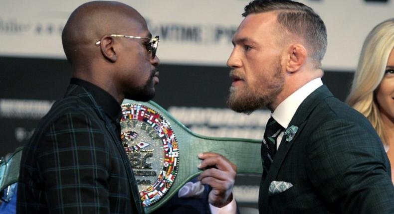 Boxer Floyd Mayweather Jr. (L) and MMA figher Connor Mcgregor face-off during a media press conference August 23, 2017 at the MGM Grand in Las Vegas, Nevada