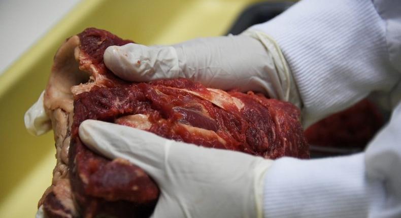 Experts analyse meat seized in markets in Rio de Janeiro, Brazil, on March 20, 2017