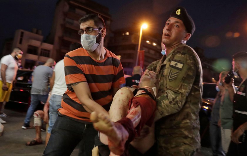 Damaged vehicle and buildings are pictured near the site of Tuesday's blast in Beirut's port area