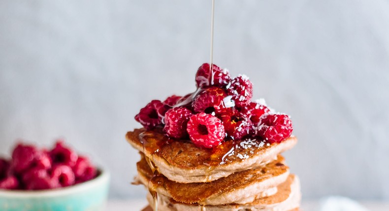 The pancakes are made with almond flour, and several eggs. He tops them with sugar-free syrup and butter. OatmealStories/Getty Images