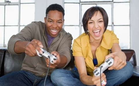 Young black couple playing video games