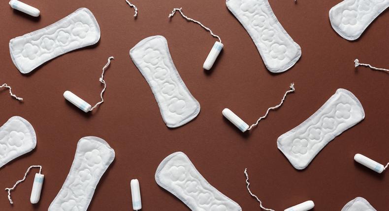 Sanitary towels and tampons on a brown background [Photo: Cliff Booth]