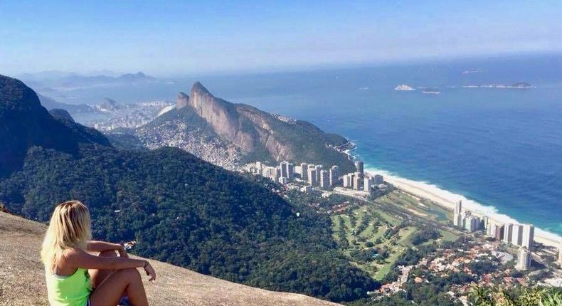 When you start working, you feel like 'Oh my god, I'll never be able to do that again — backpack around Southeast Asia for three months, says Greta Omoboni, pictured taking a break from hiking up Pedra Bonita in Rio de Janeiro, Brazil.