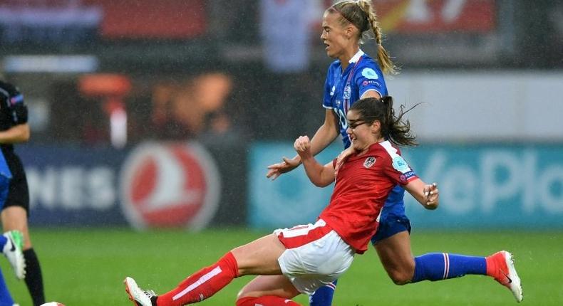 Austria's Sarah Zadrazil challenges Iceland's Dagny Brynjarsdottir (back) during their UEFA Women's Euro 2017 match, at the Sparta Stadium in Rotterdam, on July 26