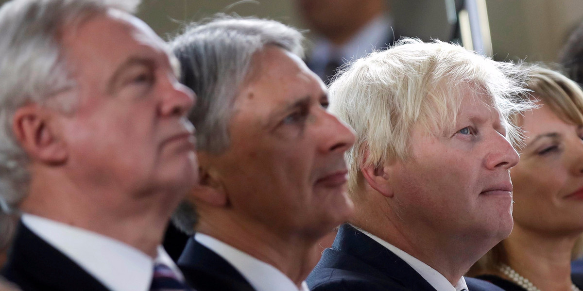 Chancellor Philip Hammond (C) with Foreign Secretary Boris Johnson (R) and Brexit Secretary David Davis