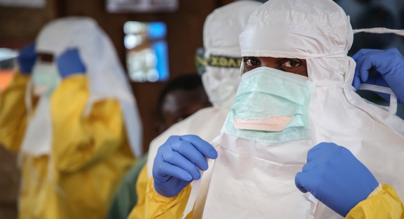 Medical professionals wearing protective gear