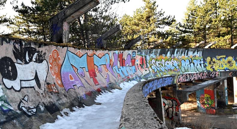 The partially dismantled bobsleigh track which was damaged during past conflicts lies abandoned on Mount Trebevic, near Sarajevo on February 6, 2024.ELVIS BARUKCIC/AFP/Getty Images