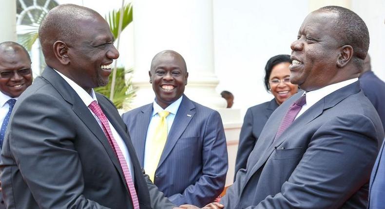 President William Ruto shares a light moment with CS Matiang'i at State House on September 27, 2022