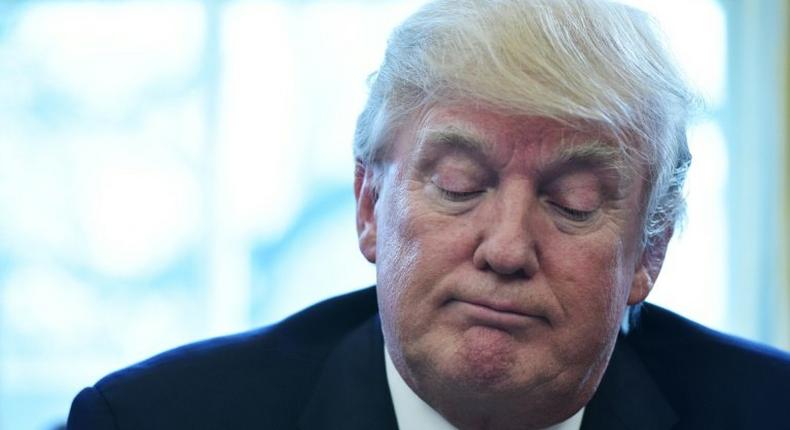 US President Donald Trump pauses as he speaks from the Oval Office of the White House in Washington, DC, on March 24, 2017