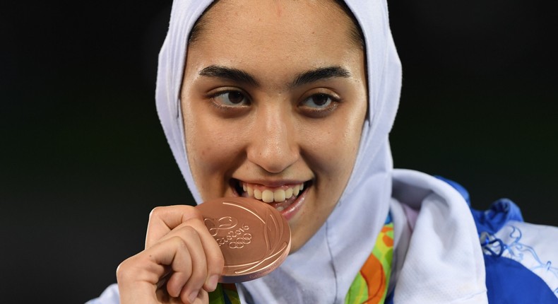 Iran's Kimia Alizadeh Zenoorin poses with her bronze medal on the podium after the womens taekwondo event in the -57kg category as part of the Rio 2016 Olympic Games, on August 18, 2016, at the Carioca Arena 3, in Rio de Janeiro.