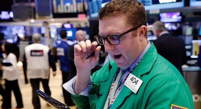 A trader works on the floor of the NYSE