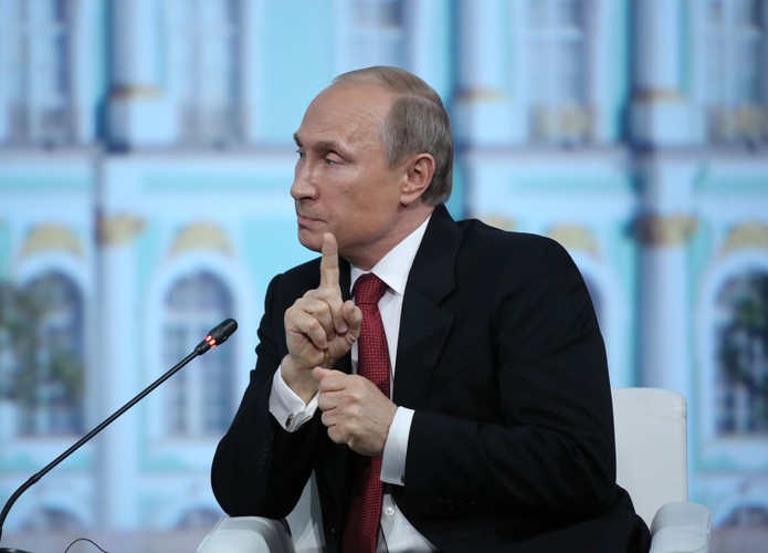 23 Maja 2014. Prezydent Rosji Władimir Putin przemawia na sesji plenarnej podczas Międzynarodowego Forum Ekonomicznego w Petersburgu.