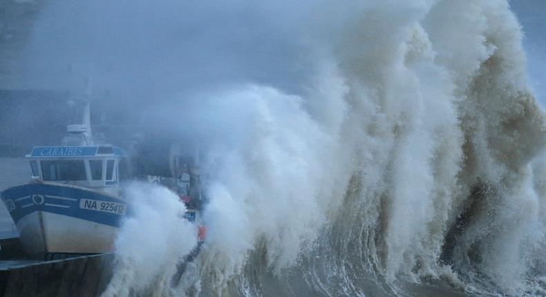 A wave crashes on the protecting wall at the fishing harbour in Pornic, France as stormy weather with high winds hits the French Atlanitic coast.
