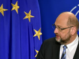 EP President Schulz looks at a european flag as he givesa statement after the conference of Presidents at the European Parliament in Brussels