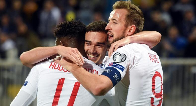 England's Harry Winks (C) celebrates after scoring the opening goal against Kosovo