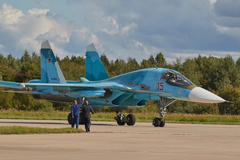 Technicians look over an Su-34 at an airfield in Kubinka, Russia, August 29, 2020.Mihail Tokmakov/SOPA Images/LightRocket via Getty Images