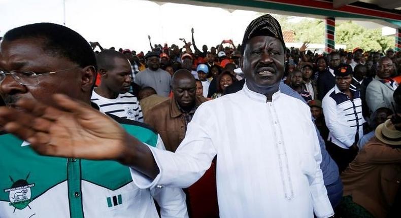 Leaders of Kenya's opposition Coalition for Reforms and Democracy (CORD), Raila Odinga (R) and Moses Wetangula (L) arrive at a rally to mark Kenya's Madaraka Day, the 53rd anniversary of the country's self rule, at Uhuru Park grounds in Nairobi, Kenya, June 1, 2016. REUTERS/Goran Tomasevic