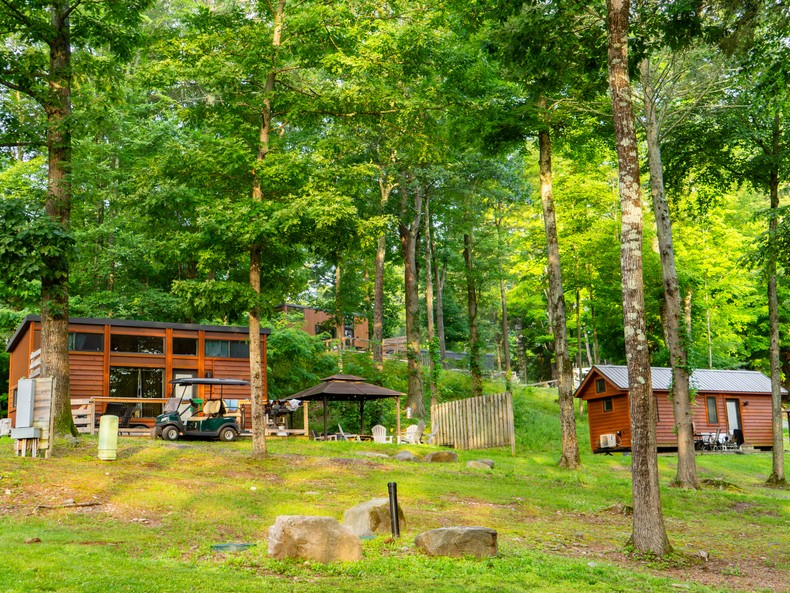 The homes look like little modern cabins among the trees. The resort also has campsites and plenty of amenities and activities, from kayaking and lawn games to art classes and outdoor movies.There's also a pool, a gift shop, and some farm animals, including flocks of ducks and chickens, as well as a herd of sheep and goats that guests can join on daily walks.