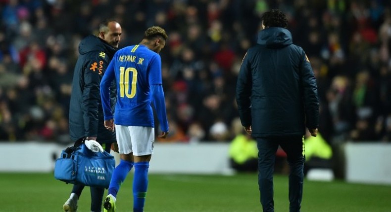 Neymar leaves the pitch injured during the international friendly between Brazil and Cameroon in Milton Keynes, central England