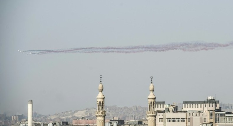 Three photojournalists have been detained after conducting street interviews with members of the public in central Cairo