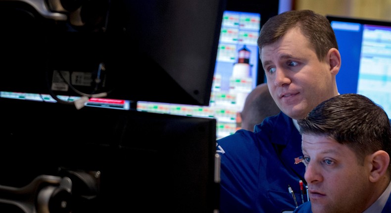 Traders work on the floor of the New York Stock Exchange February 4, 2014. 