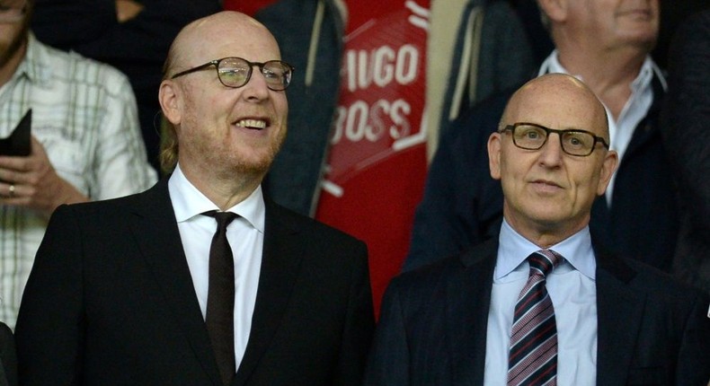 Manchester United co-chairman Joel Glazer (R) with his brother and fellow owner Avram Glazer (L) Creator: Oli SCARFF