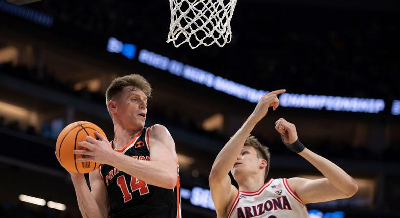 Princeton guard Matt Allocco grabs a rebound in front of Arizona forward Henri Veesaar in the NCAA Tournament.AP Photo/Jos Luis Villegas