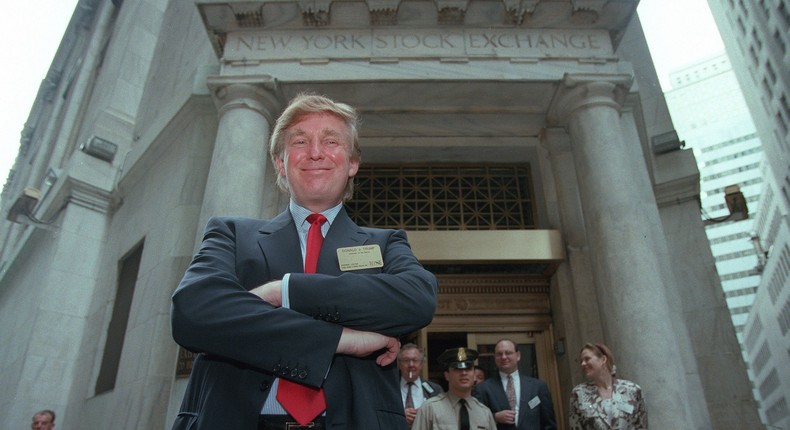 Developer Donald Trump poses for photos outside the New York Stock Exchange after the listing of his stock on Wed., June 7, 1995 in New York.