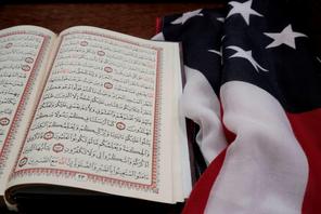 The Koran and and the U.S. flag are seen on the podium before a vigil in honor of New Zealand mosque attack victims at Dar Al-Hijrah Islamic Center in Falls Church