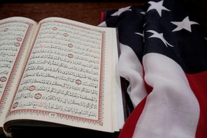 The Koran and and the U.S. flag are seen on the podium before a vigil in honor of New Zealand mosque attack victims at Dar Al-Hijrah Islamic Center in Falls Church