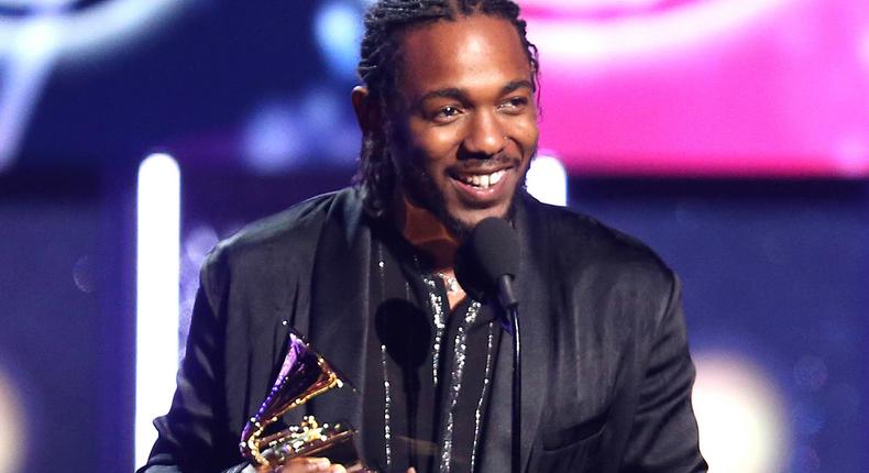 Kendrick Lamar onstage with his Grammys [billboard]