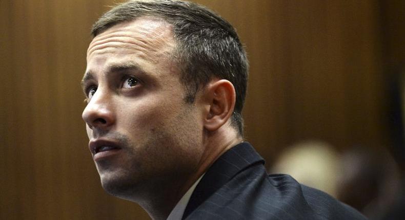 Blade Runner Oscar Pistorius sits in the dock in the North Gauteng High Court in Pretoria, in this file picture taken March 4, 2014.    REUTERS/Antoine de Ras/Pool /Files