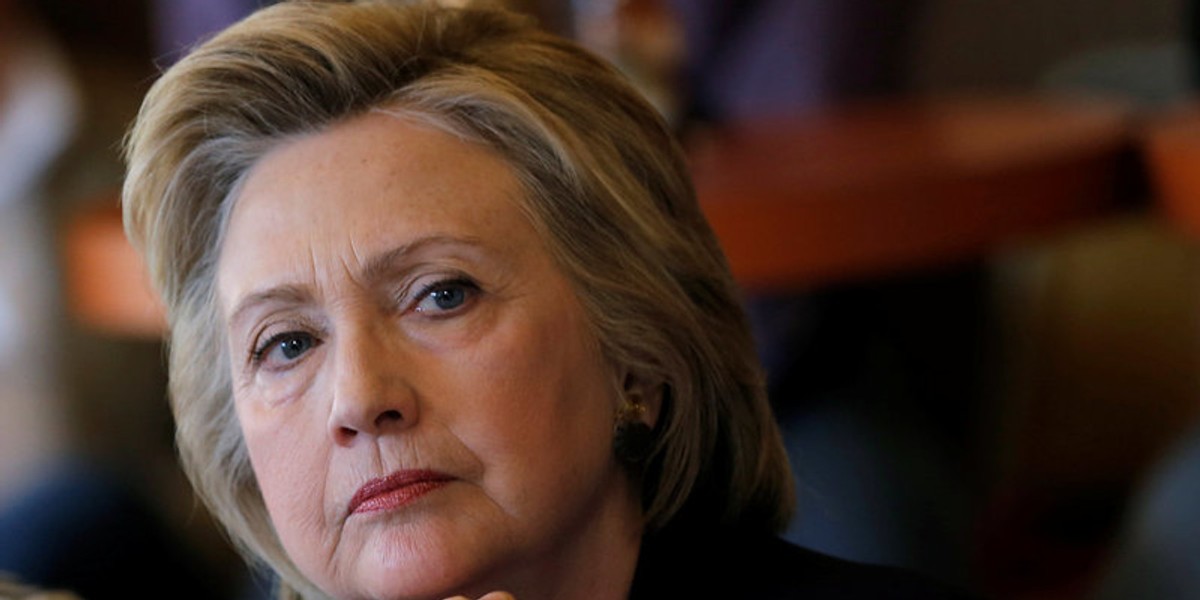 U.S. Democratic presidential candidate Hillary Clinton listens to steelworkers during a campaign event in Ashland