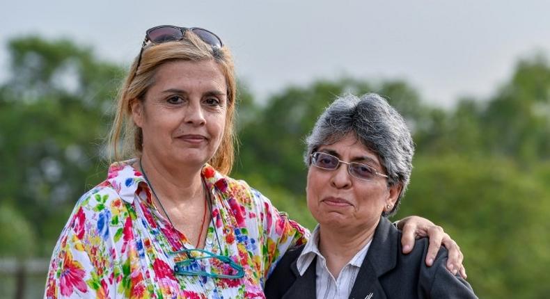 Frenchwoman Marie-Emmanuelle Verhoeven poses with her lawyer Ramni Taneja (R) in 2016