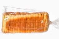 Sliced bread on white surface.